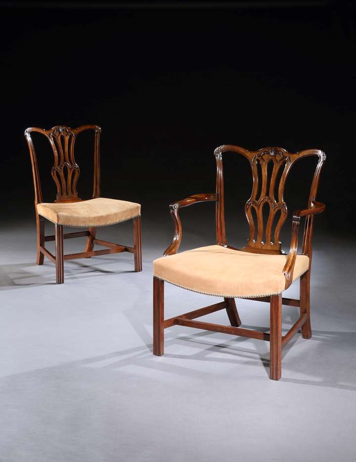 A SET OF TEN GEORGE III MAHOGANY DINING CHAIRS AND FOUR SIDE CHAIRS OF LATER DATE